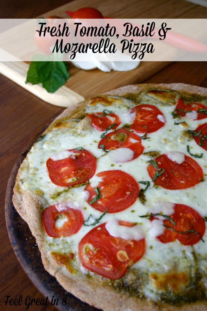It doesn't get much better than pesto, tomatoes and fresh mozzarella cheese on a nutty whole wheat pizza crust! Feel Great in 8 #healthyrecipe #pizza #tomatoes
