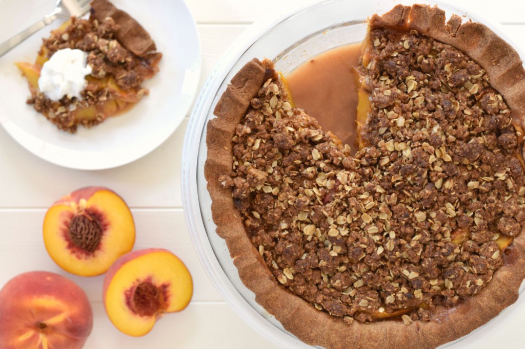 Peach pie and peach cobbler come together in a healthy dessert makeover! This Peach Crumble Pie comes with all the flavor, a flakey crust, and a sweet streusel topping - but with whole grains and no refined sugar!