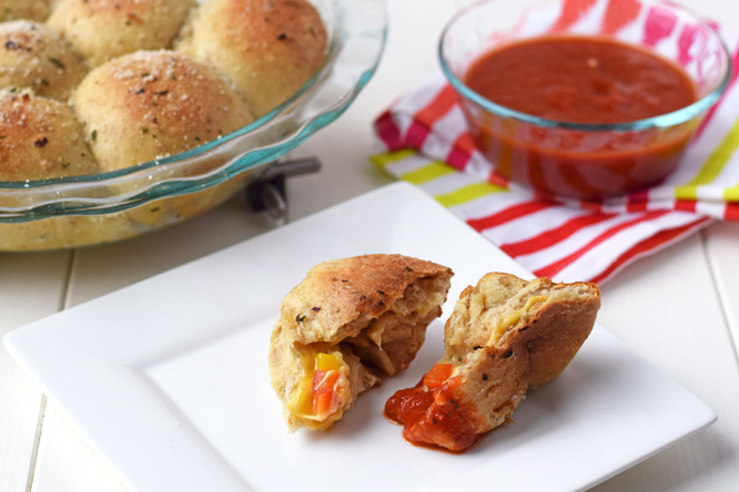 Veggie Stuffed Pizza Rolls - Soft whole grain rolls stuffed with vegetables and cheese and dipped in pizza sauce. You'll love this quick & easy, healthy, kid-friendly dinner!