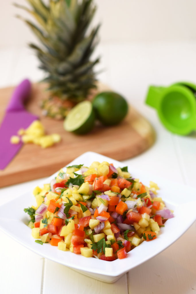 This Fresh Pineapple Salsa is the perfect summer side dish or party appetizer! Only 6 fresh ingredients and 15 minutes to make and the flavor is amazing.